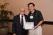 Dr. Nagib Callaos, General Chair, giving Dr. Yuan-Shyi Peter Chiu the best paper award certificate of the session "Management, Engineering and Informatics I ." The title of the awarded paper is "On Finite Production Rate Model with Quality Assurance, Multi-Customer, and Discontinuous Deliveries."